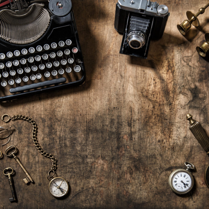 Antique typewriter vintage items photo camera worthy of discussion on an American history podcast.
